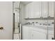 Clean, white laundry area featuring a washer and dryer at 2660 Peachtree Nw Rd # 23A, Atlanta, GA 30305