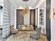 Bright living area featuring contemporary decor, stylish furniture, and a modern light fixture at 2660 Peachtree Nw Rd # 23A, Atlanta, GA 30305