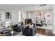 Elegant living room featuring modern decor, sophisticated lighting, and an open floor plan to the dining area at 2660 Peachtree Nw Rd # 23A, Atlanta, GA 30305