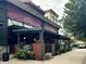 Fadó Irish Pub offering a cozy outdoor dining area with string lights and lush landscaping at 2660 Peachtree Nw Rd # 23A, Atlanta, GA 30305