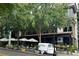YEPPA! restaurant showcasing outdoor seating with umbrellas, lush greenery, and a vintage delivery truck at 2660 Peachtree Nw Rd # 23A, Atlanta, GA 30305