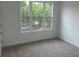 Bright bedroom with large windows showcasing a lush outdoor view at 358 Olmstead Way # 25, Alpharetta, GA 30022
