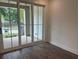 Bright bedroom with sliding glass doors leading to a balcony, offering scenic views at 358 Olmstead Way # 25, Alpharetta, GA 30022