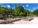 Inviting outdoor community space with seating and landscaped planters at 358 Olmstead Way # 25, Alpharetta, GA 30022