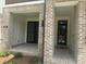 Inviting front porch with brick flooring, offering a cozy entrance to the townhome at 358 Olmstead Way # 25, Alpharetta, GA 30022