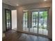 Bright living space featuring a door and large sliding glass doors to the outdoor space at 358 Olmstead Way # 25, Alpharetta, GA 30022