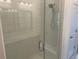 Modern bathroom shower with glass doors, subway tile, and a rainfall shower head at 358 Olmstead Way # 25, Alpharetta, GA 30022