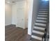 Clean staircase design with hardwood treads, white risers, and light-filled open space at 358 Olmstead Way # 25, Alpharetta, GA 30022