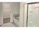 Bathroom featuring a bathtub, walk-in shower, and access to a walk-in closet at 4849 Walkers Green, Mableton, GA 30126