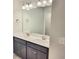 Bathroom features a large mirror and a double sink vanity with dark cabinets at 4849 Walkers Green, Mableton, GA 30126