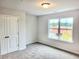 Bedroom with a double-door closet and large window at 4849 Walkers Green, Mableton, GA 30126