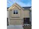 Exterior view of a townhome featuring an attached garage and neutral siding at 4849 Walkers Green, Mableton, GA 30126