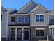 Beautiful new two-story home with brick and siding and a covered front porch at 4849 Walkers Green, Mableton, GA 30126