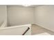 Bright hallway with neutral carpet and railing that leads to the next floor at 4849 Walkers Green, Mableton, GA 30126