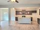 Open concept kitchen with stainless appliances, granite countertops, and gray cabinets at 4849 Walkers Green, Mableton, GA 30126