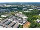 Aerial view featuring a modern townhome community surrounded by lush greenery and urban landscape at 1244 Chelsea Nw Cir, Atlanta, GA 30318
