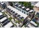 Aerial view of townhomes with rooftop terraces, lush landscaping, and modern architecture at 1244 Chelsea Nw Cir, Atlanta, GA 30318