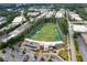 Stunning aerial view of a Top Golf entertainment facility surrounded by lush greenery and nearby commercial buildings at 1244 Chelsea Nw Cir, Atlanta, GA 30318