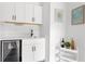 Stylish bar area featuring ample storage, a beverage fridge, and elegant decor at 1244 Chelsea Nw Cir, Atlanta, GA 30318
