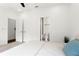 Bright bedroom with neutral carpet and white walls features a workstation and three large windows at 1244 Chelsea Nw Cir, Atlanta, GA 30318