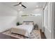 Modern bedroom features a bed, ceiling fan, and ample natural light from large windows at 1244 Chelsea Nw Cir, Atlanta, GA 30318