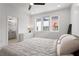 Bright bedroom featuring a ceiling fan, neutral decor, and an ensuite bathroom at 1244 Chelsea Nw Cir, Atlanta, GA 30318