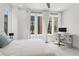 Bright bedroom features a bed, work space, and large windows that provide ample natural light at 1244 Chelsea Nw Cir, Atlanta, GA 30318
