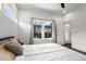Bedroom with a cozy bed, a window, and a door leading to the bathroom at 1244 Chelsea Nw Cir, Atlanta, GA 30318