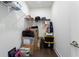 Walk-in closet with shelving and hanging storage, and items stored on the floor at 1244 Chelsea Nw Cir, Atlanta, GA 30318