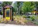 Inviting community space with information kiosks, surrounded by lush landscaping and seating areas at 1244 Chelsea Nw Cir, Atlanta, GA 30318