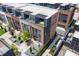 Stunning aerial view of brick townhomes featuring private rooftop terraces and meticulous landscaping at 1244 Chelsea Nw Cir, Atlanta, GA 30318