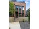 Beautiful brick townhome showcasing a modern exterior with large windows, black trim and minimalist landscaping at 1244 Chelsea Nw Cir, Atlanta, GA 30318