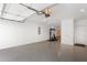Well-lit garage featuring ample space, epoxy flooring, and exercise equipment at 1244 Chelsea Nw Cir, Atlanta, GA 30318