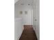 Upstairs hallway with hardwood floors and white trim provides access to bedrooms at 1244 Chelsea Nw Cir, Atlanta, GA 30318