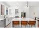 Modern kitchen with white cabinets, stainless steel appliances, and a large center island at 1244 Chelsea Nw Cir, Atlanta, GA 30318