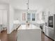 Contemporary kitchen featuring white cabinets, stainless steel appliances, and a sleek island at 1244 Chelsea Nw Cir, Atlanta, GA 30318