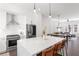 Modern kitchen with white cabinets, stainless steel appliances, and an island with seating at 1244 Chelsea Nw Cir, Atlanta, GA 30318