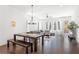 Open living space features stylish furniture, hardwood floors, and dining area with modern lighting at 1244 Chelsea Nw Cir, Atlanta, GA 30318