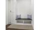 Convenient mudroom featuring built-in bench seating with storage and a coat closet at 1244 Chelsea Nw Cir, Atlanta, GA 30318