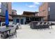 Upscale outdoor kitchen and dining area with a bar, comfortable seating, and modern finishes at 1244 Chelsea Nw Cir, Atlanta, GA 30318