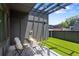 Inviting outdoor patio features artificial turf and modern pergola, ideal for relaxing or entertaining at 1244 Chelsea Nw Cir, Atlanta, GA 30318