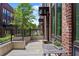 Charming outdoor patio with brick accents, an iron railing, and comfortable seating for relaxing at 1244 Chelsea Nw Cir, Atlanta, GA 30318