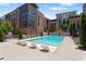 Community swimming pool with modern lounge seating and manicured landscaping at 1244 Chelsea Nw Cir, Atlanta, GA 30318