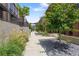 Landscaped walkway between modern townhomes, showcasing stylish architecture and greenery at 1244 Chelsea Nw Cir, Atlanta, GA 30318