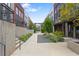 Modern townhome walkway featuring lush landscaping and architectural design at 1244 Chelsea Nw Cir, Atlanta, GA 30318