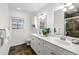 Bathroom with double sink vanity, ample storage, and modern fixtures at 1597 Fama Ne Dr, Atlanta, GA 30329