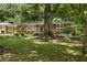 Brick home with manicured lawn and landscaping at 1597 Fama Ne Dr, Atlanta, GA 30329