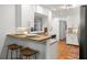 Bright kitchen with breakfast bar, modern appliances, and hardwood floors at 1597 Fama Ne Dr, Atlanta, GA 30329