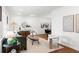Bright living room with modern furniture, white walls and ample natural light, flowing into dining area at 1597 Fama Ne Dr, Atlanta, GA 30329