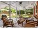 Relaxing screened-in porch with comfortable seating for outdoor enjoyment at 1597 Fama Ne Dr, Atlanta, GA 30329